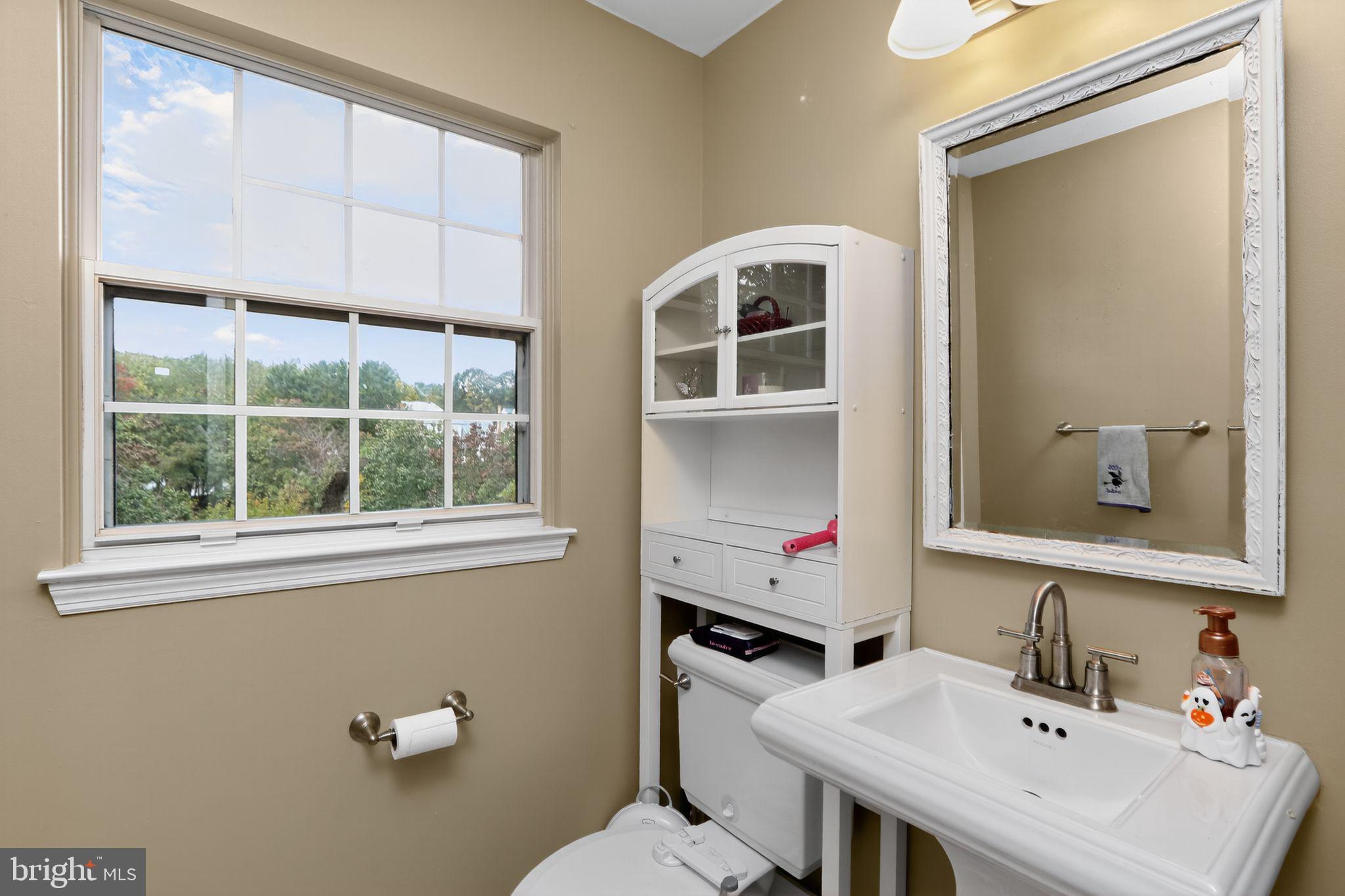 16601 Accolon Court Dumfries, VA 22025 - Photo 26 of 34 a bathroom with a sink vanity and a toilet