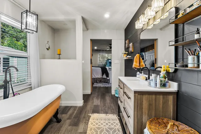 a bathroom with a sink a toilet and mirror