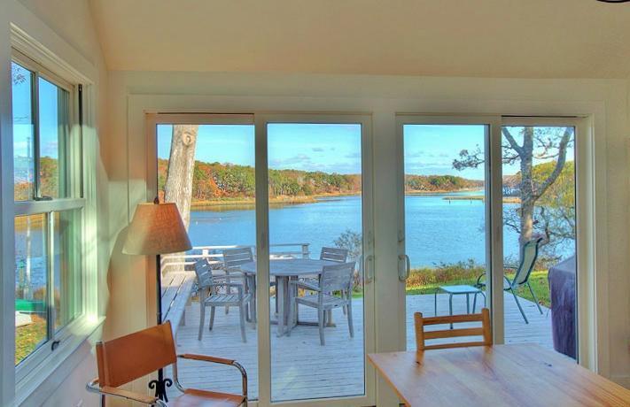 124 Namequoit Road Orleans, MA 02653 - Photo 15 of 30 a living room with furniture and large windows