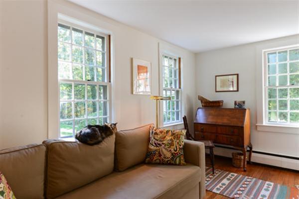 124 Namequoit Road Orleans, MA 02653 - Photo 16 of 30 a living room with furniture and a window