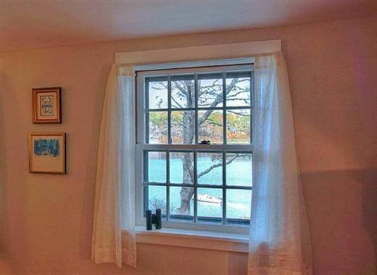 124 Namequoit Road Orleans, MA 02653 - Photo 19 of 30 a view of an empty room with a window