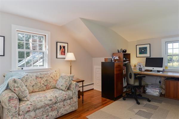 124 Namequoit Road Orleans, MA 02653 - Photo 20 of 30 a living room with furniture and a window