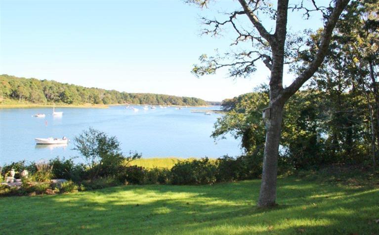 124 Namequoit Road Orleans, MA 02653 - Photo 26 of 30 a front view of a house with a yard