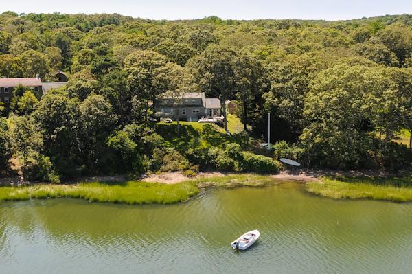 124 Namequoit Road Orleans, MA 02653 - Photo 30 of 30 a view of a lake with mountains in the background