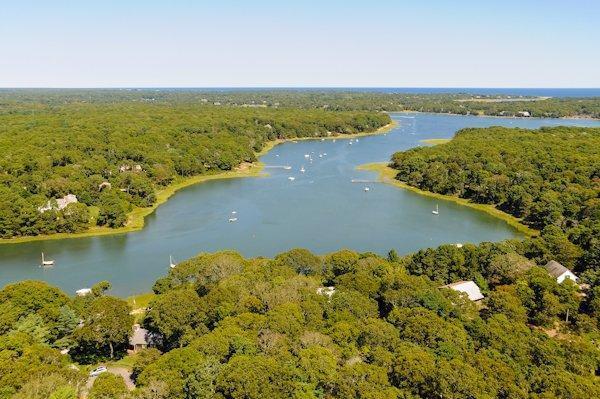 124 Namequoit Road Orleans, MA 02653 - Photo 3 of 30 an aerial view of ocean with residential houses with outdoor space