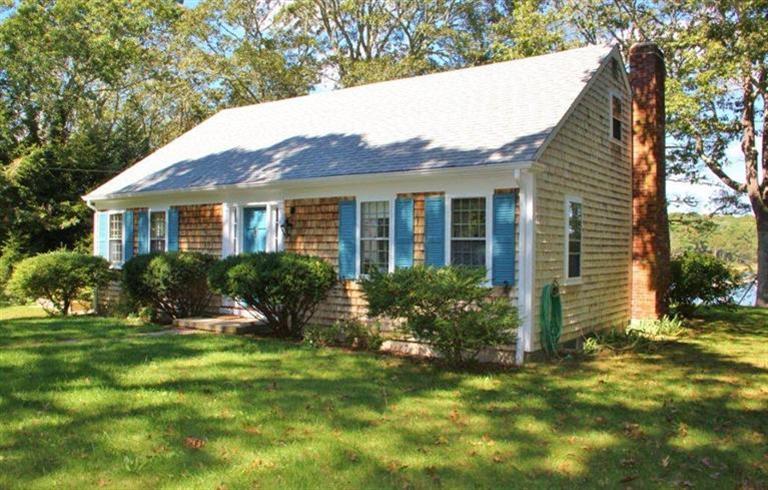 124 Namequoit Road Orleans, MA 02653 - Photo 4 of 30 a front view of a house with a yard