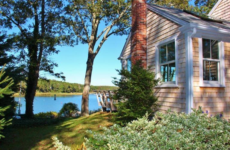 124 Namequoit Road Orleans, MA 02653 - Photo 5 of 30 a front view of a house with a yard