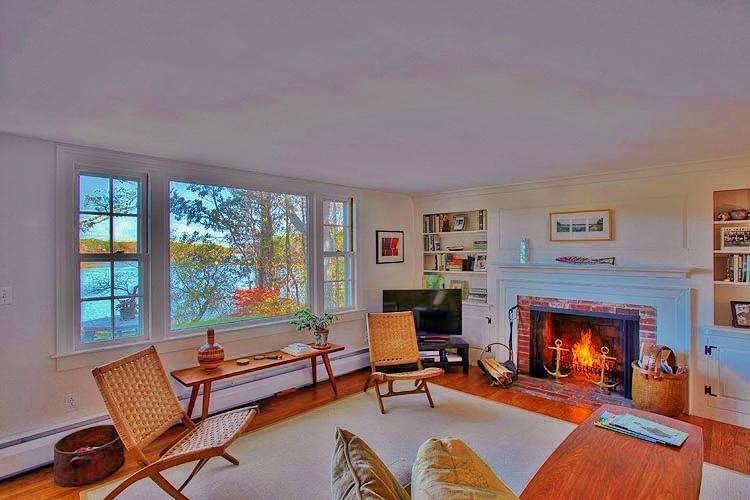 124 Namequoit Road Orleans, MA 02653 - Photo 8 of 30 a living room with furniture and a fireplace