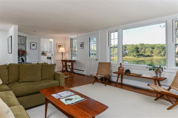 124 Namequoit Road Orleans, MA 02653 - Photo 9 of 30 a living room with furniture and a large window