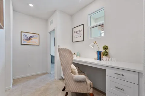 a workspace with furniture and window
