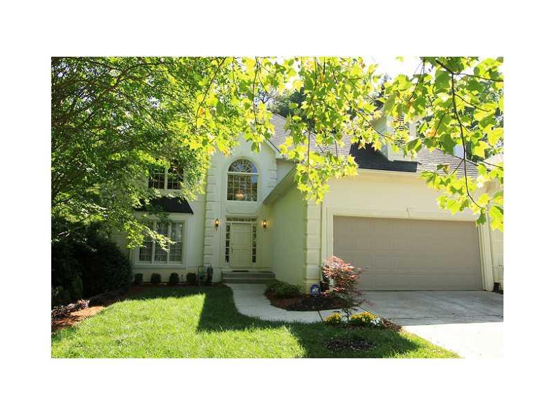 Exterior Front. Mature trees surround the this large home on a private cul de sac.