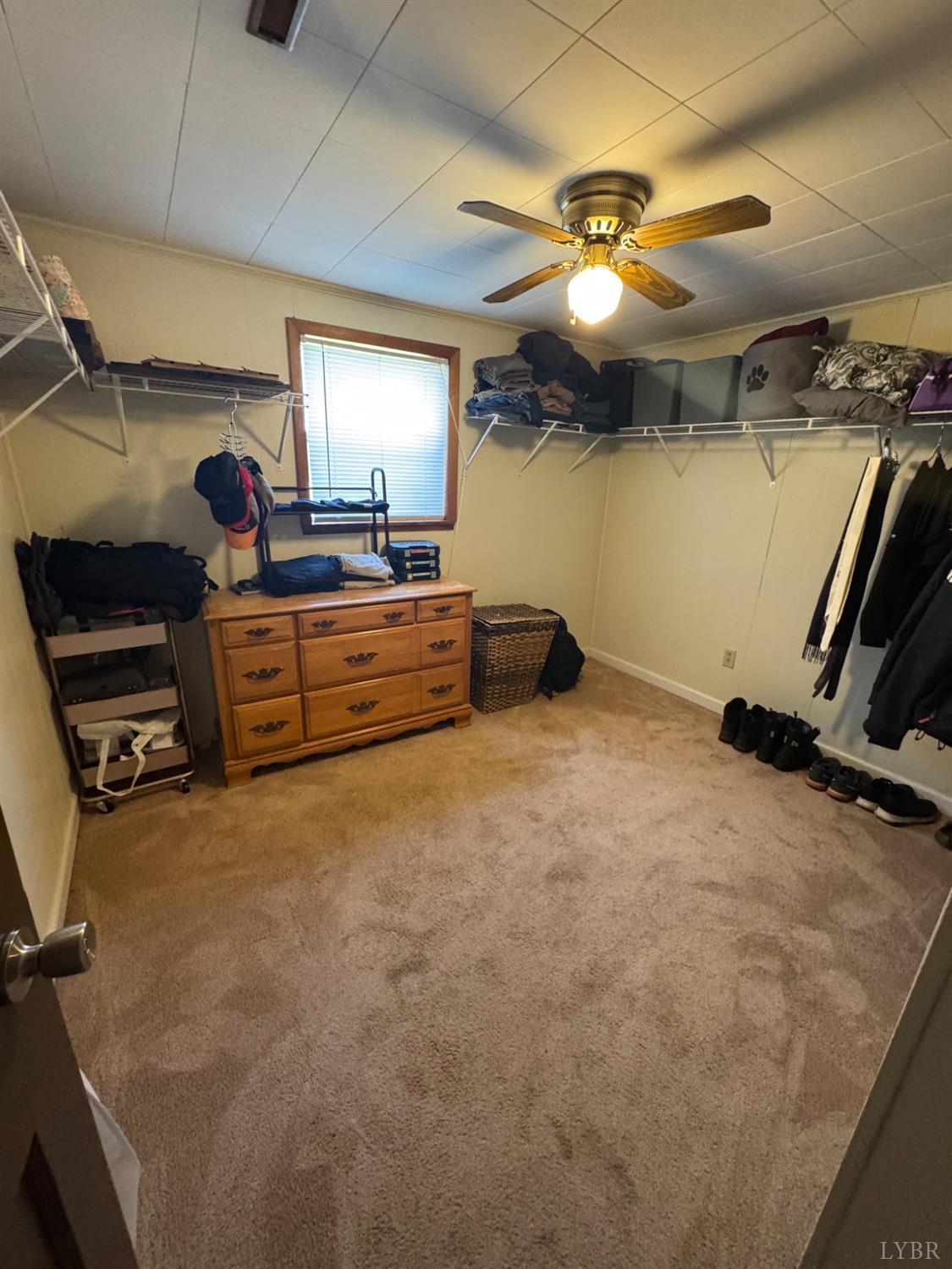 108 Hillside Road Hurt, VA 24563 - Photo 17 of 28 a bed room with a bed and a ceiling fan