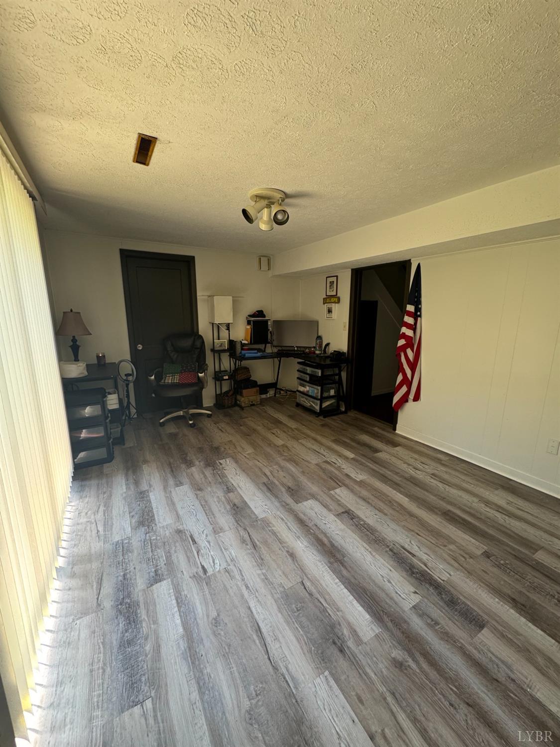 108 Hillside Road Hurt, VA 24563 - Photo 21 of 28 a view of kitchen with furniture and wooden floor