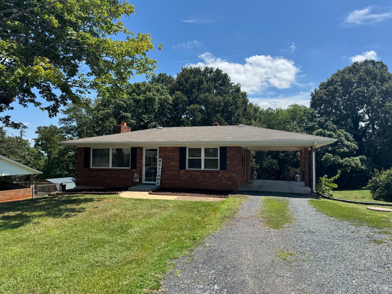 108 Hillside Road Hurt, VA 24563 - Photo 25 of 28 a view of a house with a yard and large trees