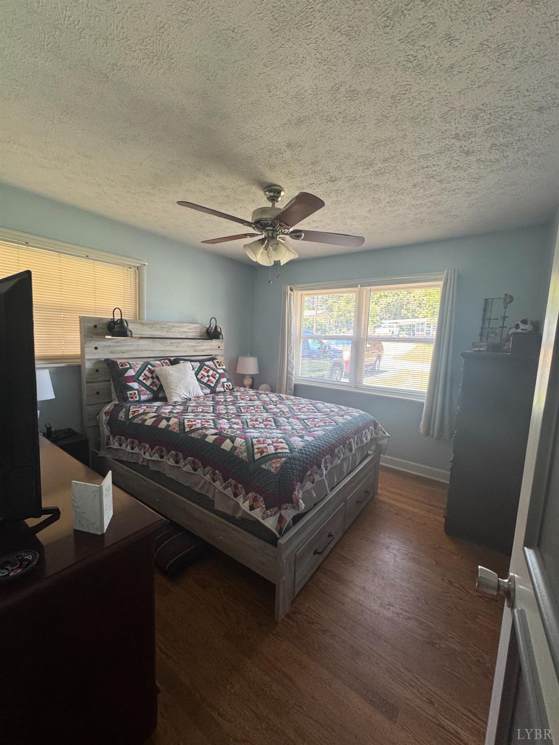 108 Hillside Road Hurt, VA 24563 - Photo 7 of 28 a bed sitting in a bedroom next to a window