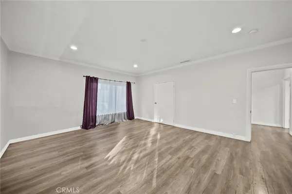 a view of an empty room with a flat screen tv