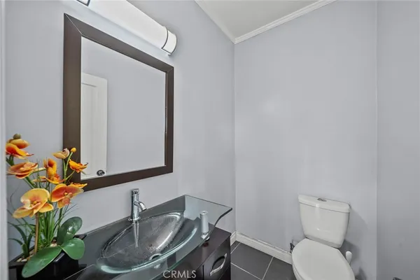 an empty room with a window and a ceiling fan