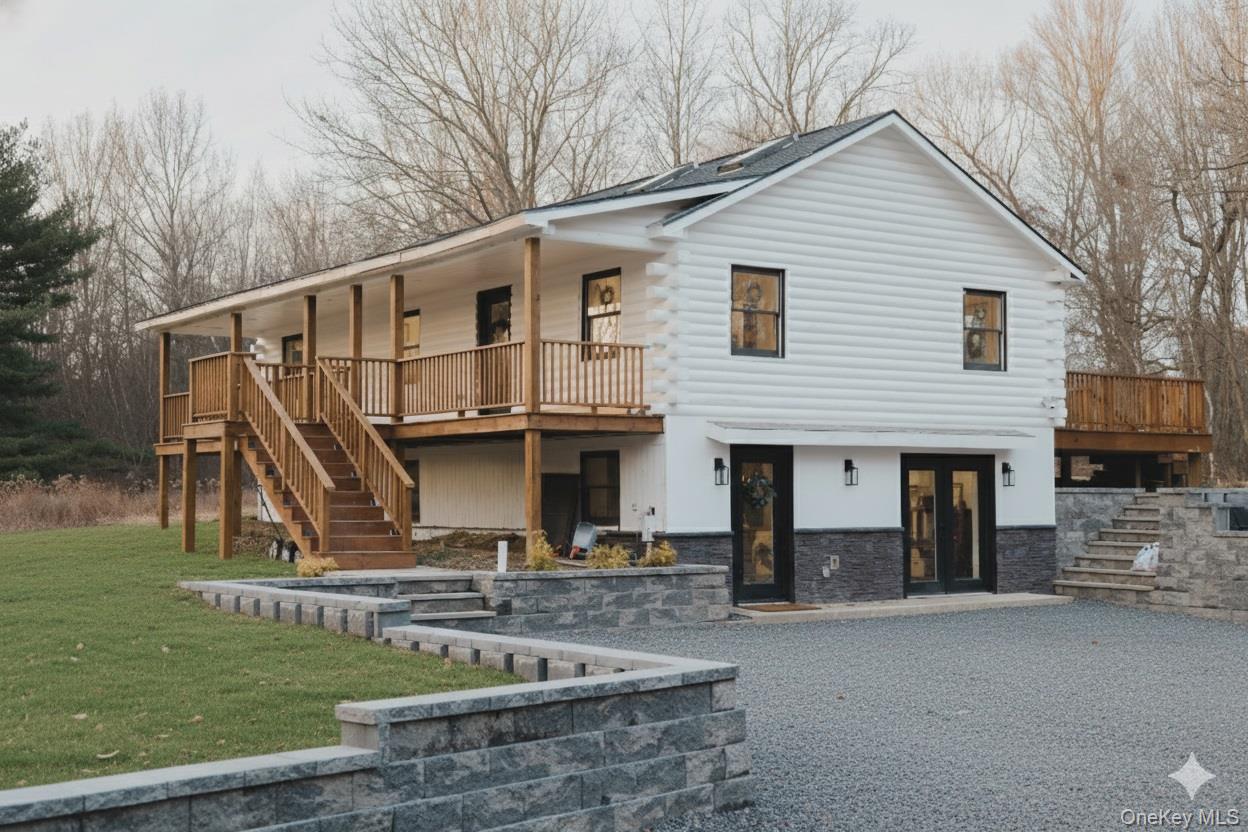 281 Falls Road Hudson, NY 12534 - Photo 1 of 27 a front view of a house with garden
