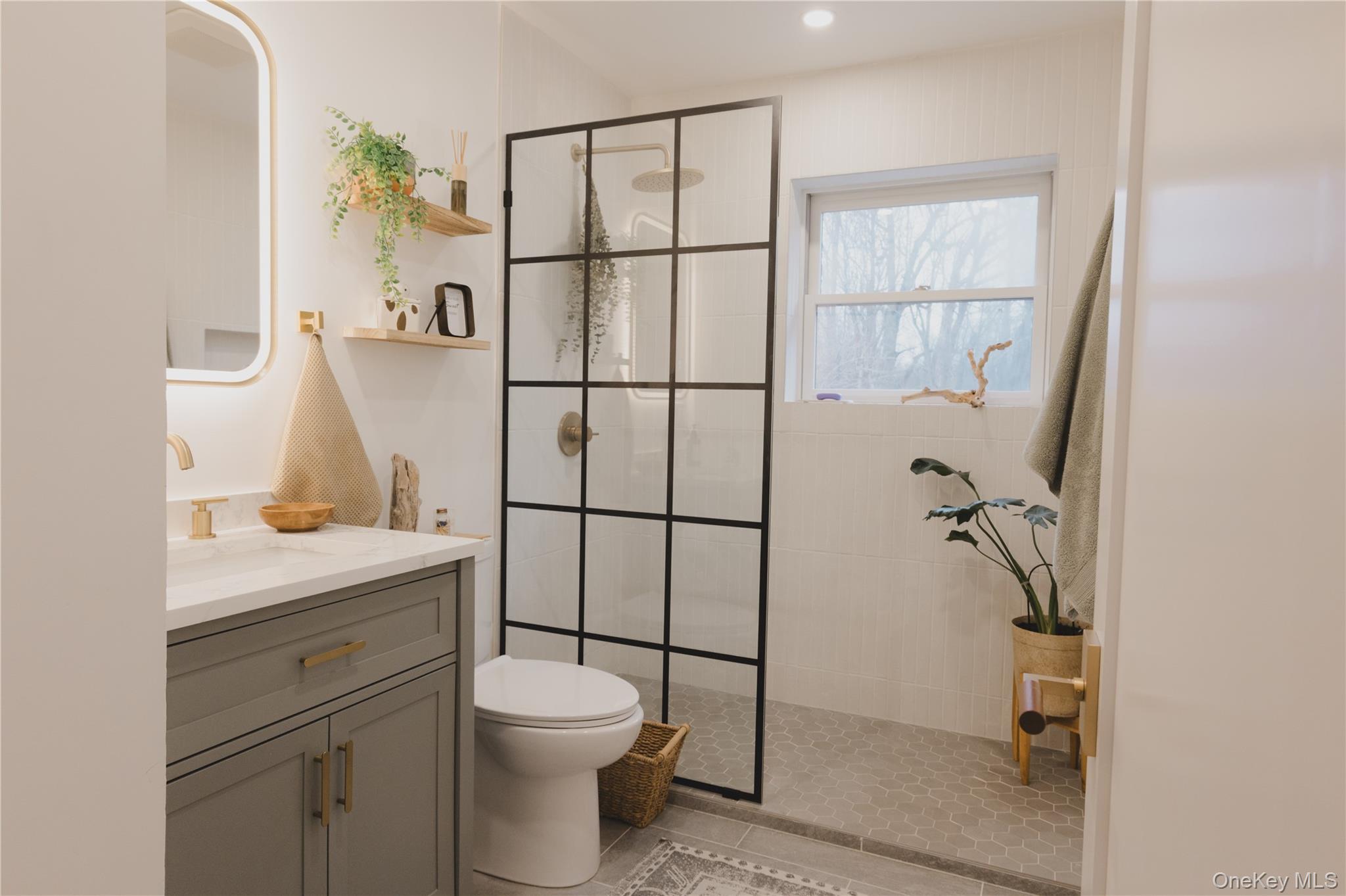 281 Falls Road Hudson, NY 12534 - Photo 14 of 27 a bathroom with a toilet sink and mirror