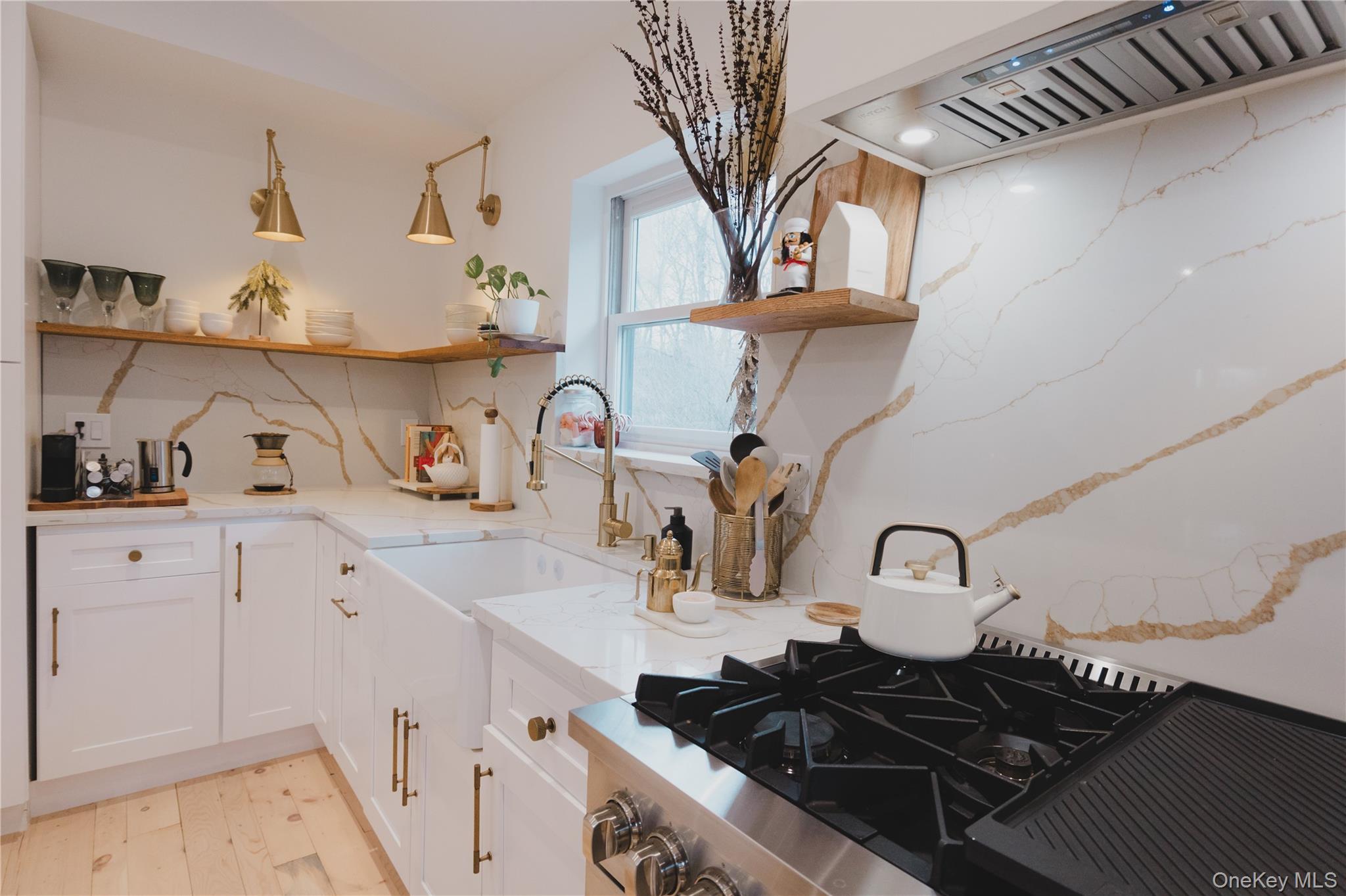 281 Falls Road Hudson, NY 12534 - Photo 3 of 27 a kitchen with a stove a sink and cabinets