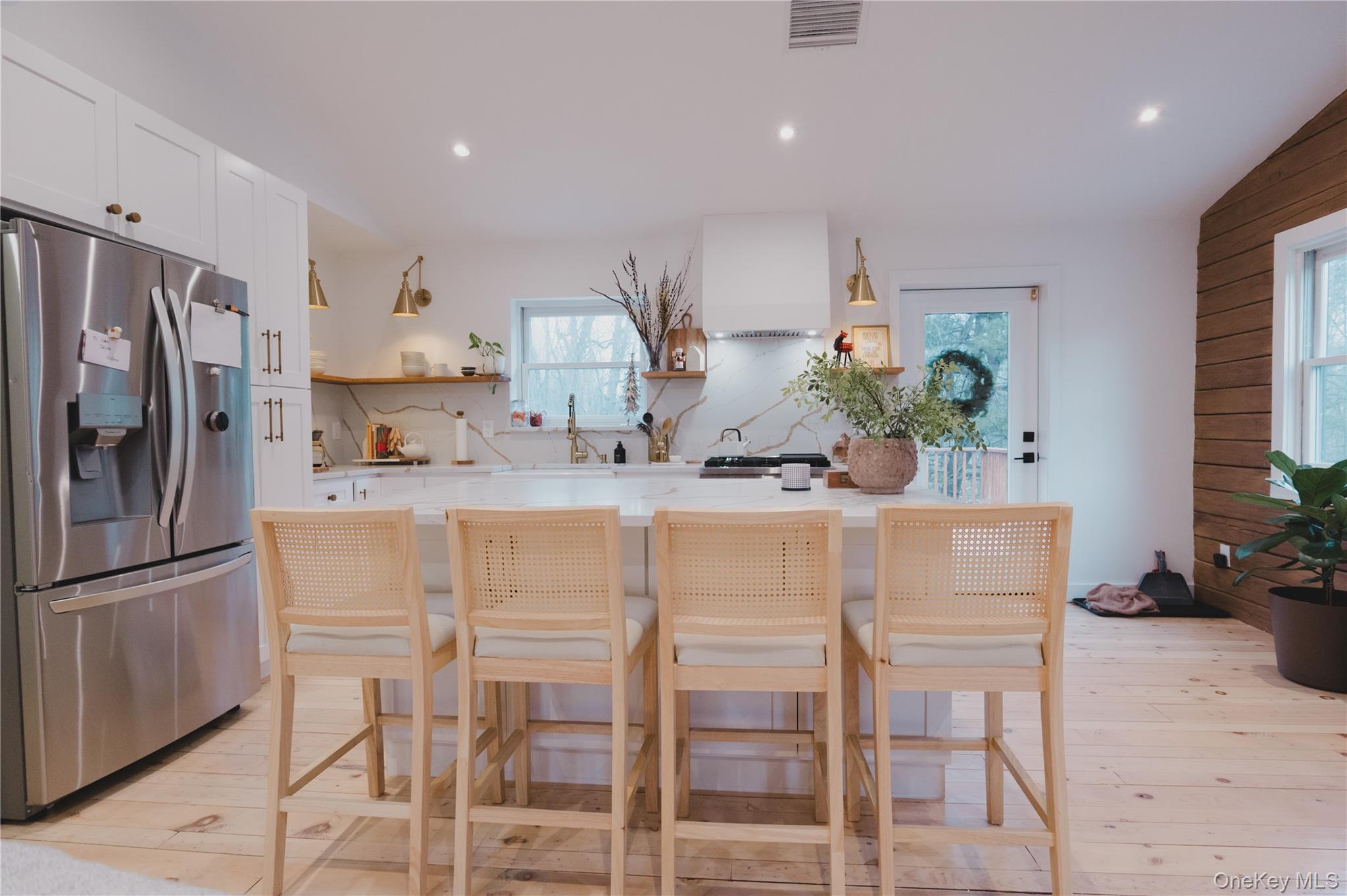281 Falls Road Hudson, NY 12534 - Photo 4 of 27 a kitchen with stainless steel appliances kitchen island granite countertop a refrigerator and a sink