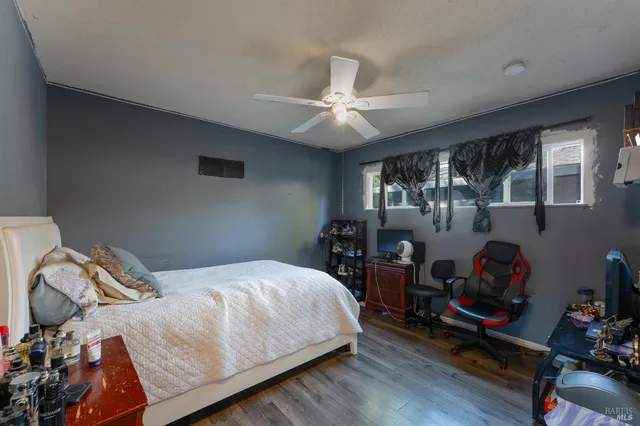 a bedroom with a bed closet and a window