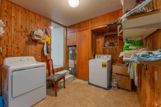 a view of storage and utility room with washer and dryer