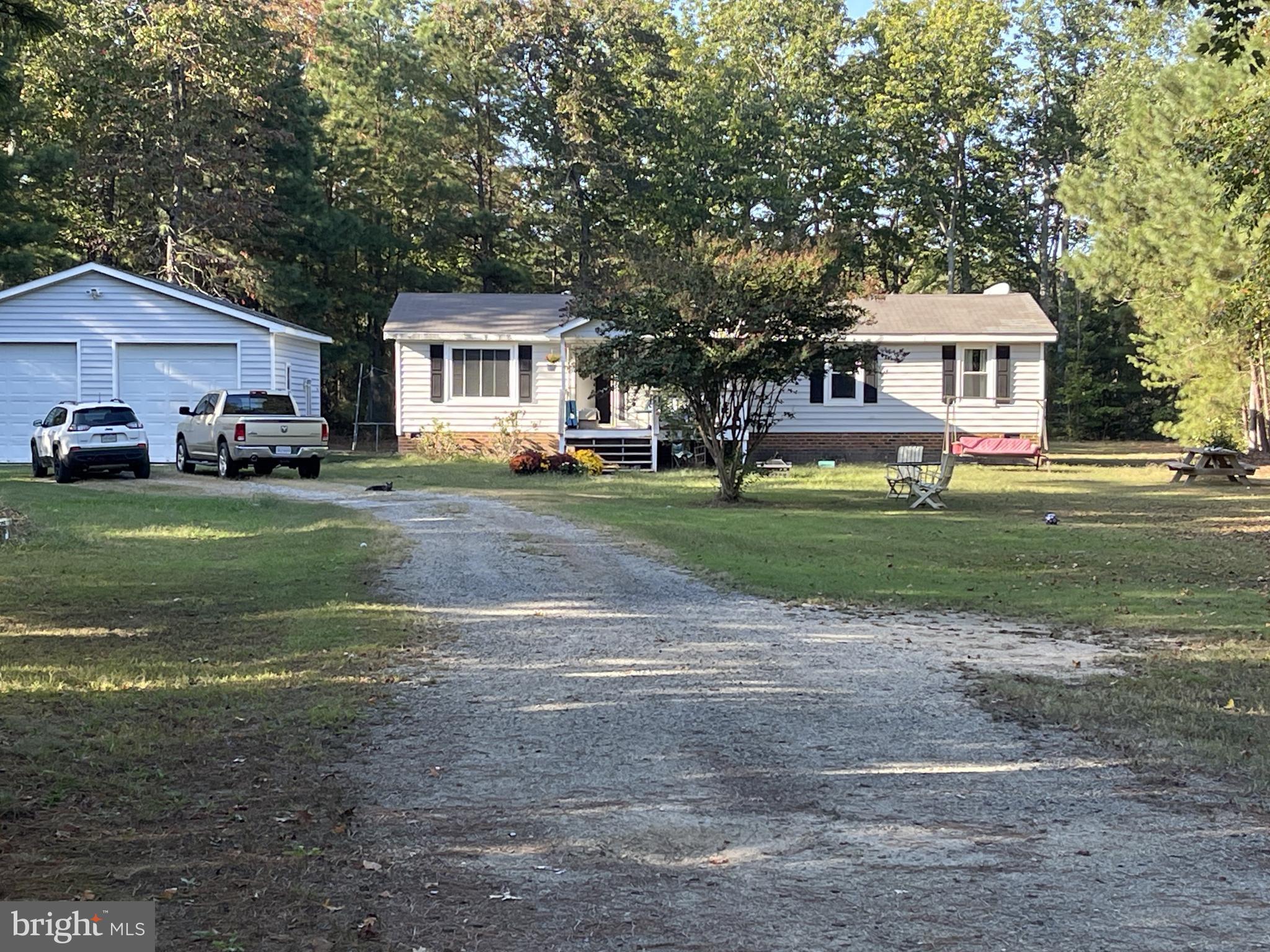 653 Blackbeard Pond Road Hague, VA 22469 - Photo 2 of 14 a view of a house with a yard
