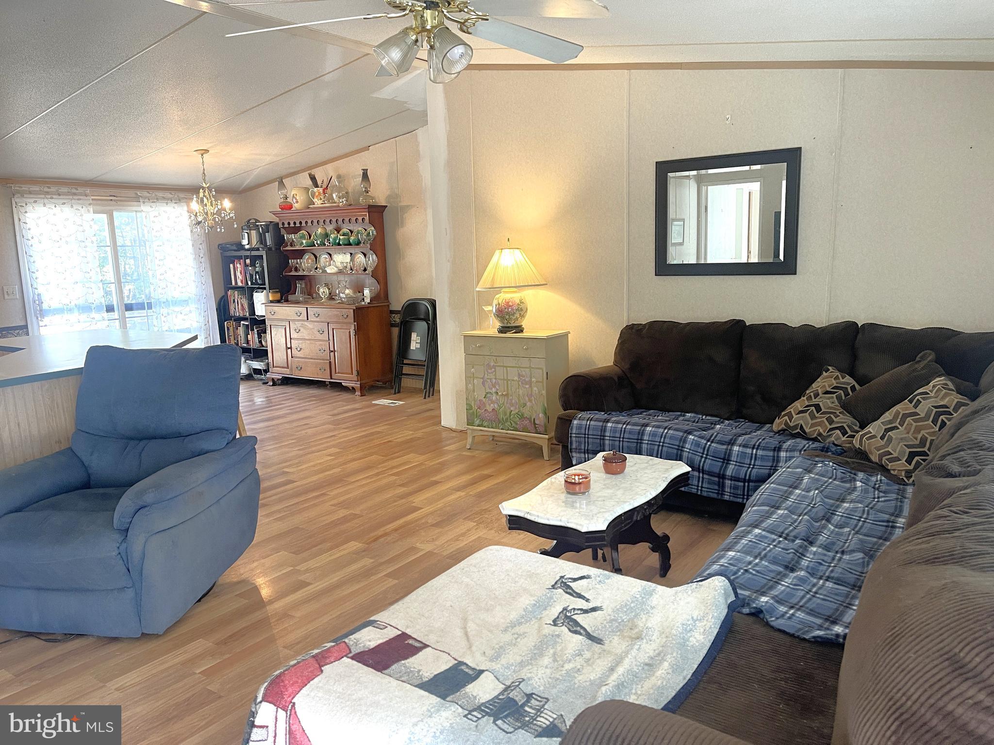 653 Blackbeard Pond Road Hague, VA 22469 - Photo 5 of 14 a living room with furniture and a large window