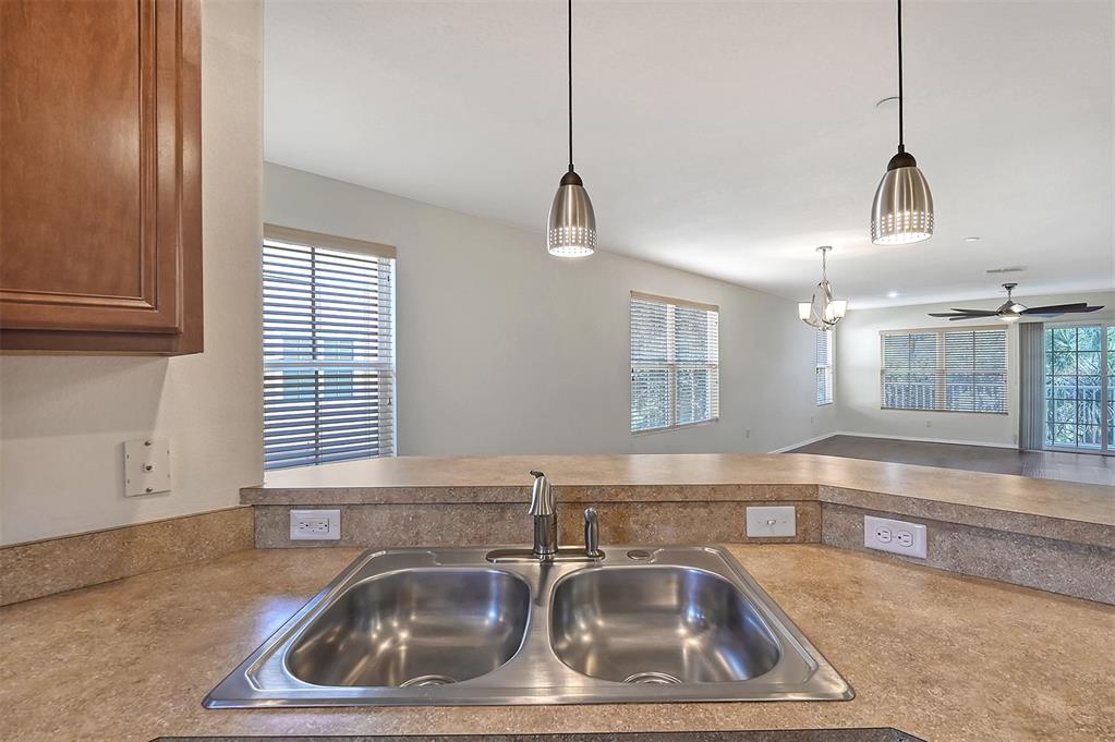 8922 White Sage Loop Lakewood Ranch, FL 34202 - Photo 19 of 65 a kitchen with a sink and a window