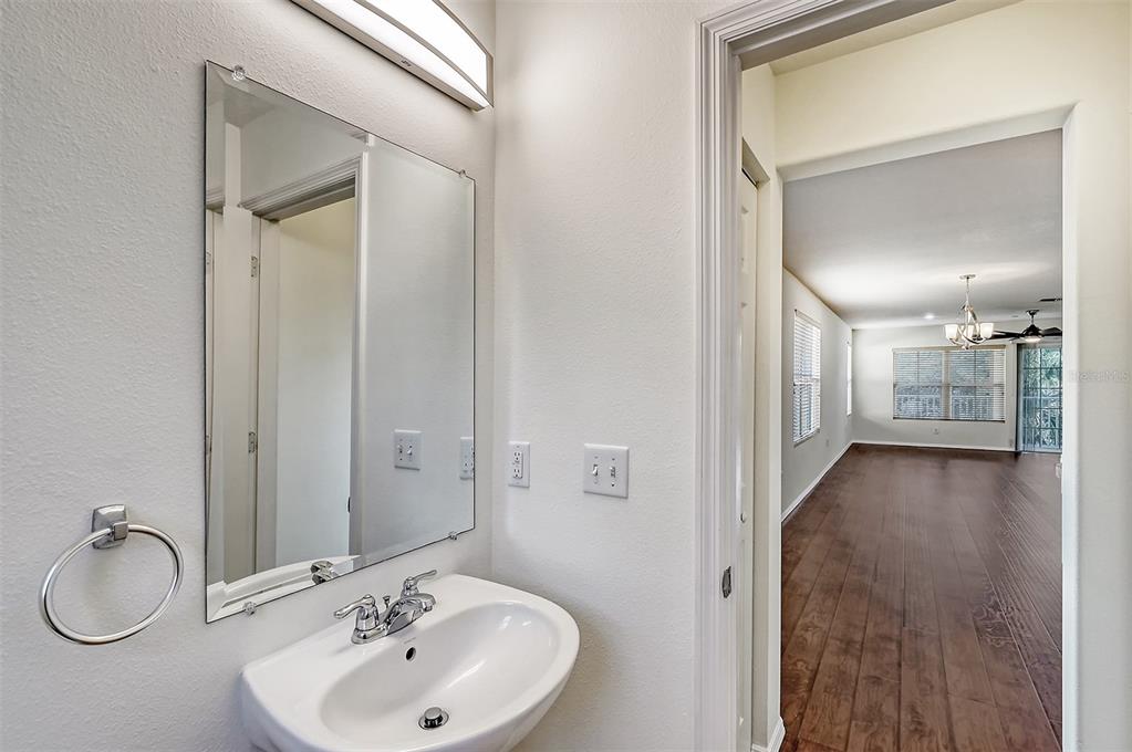 8922 White Sage Loop Lakewood Ranch, FL 34202 - Photo 20 of 65 a bathroom with a sink and a mirror