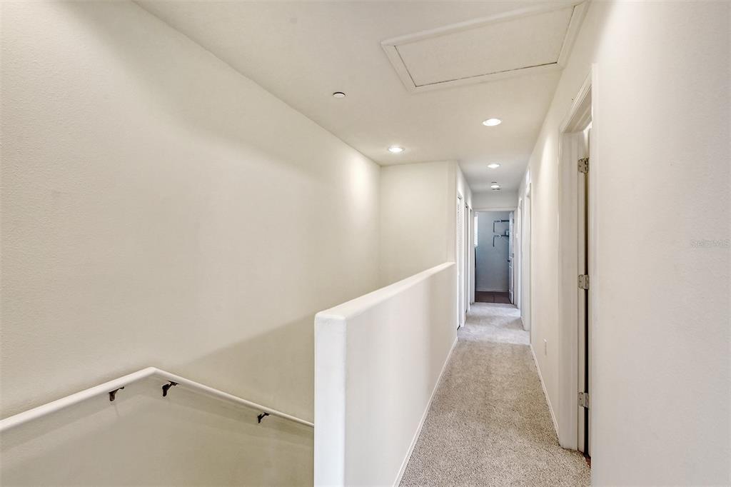 8922 White Sage Loop Lakewood Ranch, FL 34202 - Photo 25 of 65 a hallway with stairs