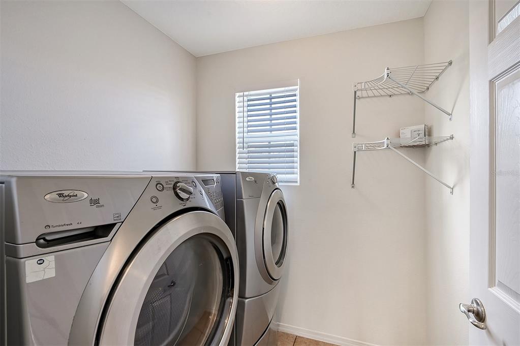 8922 White Sage Loop Lakewood Ranch, FL 34202 - Photo 27 of 65 a utility room with dryer and washer