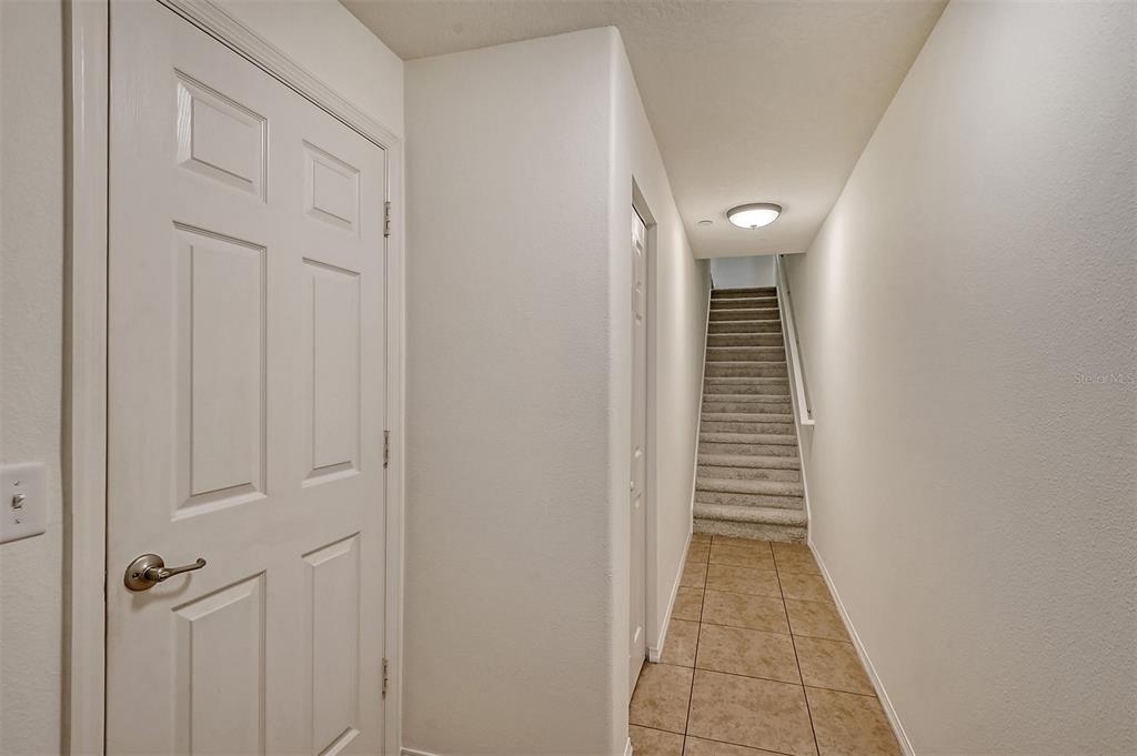 8922 White Sage Loop Lakewood Ranch, FL 34202 - Photo 4 of 65 a view of a hallway with stairs