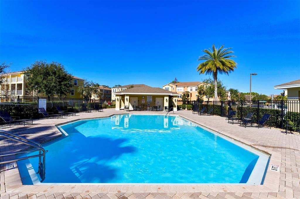8922 White Sage Loop Lakewood Ranch, FL 34202 - Photo 59 of 65 a view of swimming pool with a table and chairs