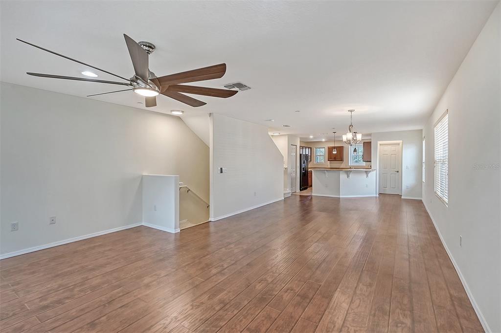 8922 White Sage Loop Lakewood Ranch, FL 34202 - Photo 6 of 65 a view of empty room with wooden floor