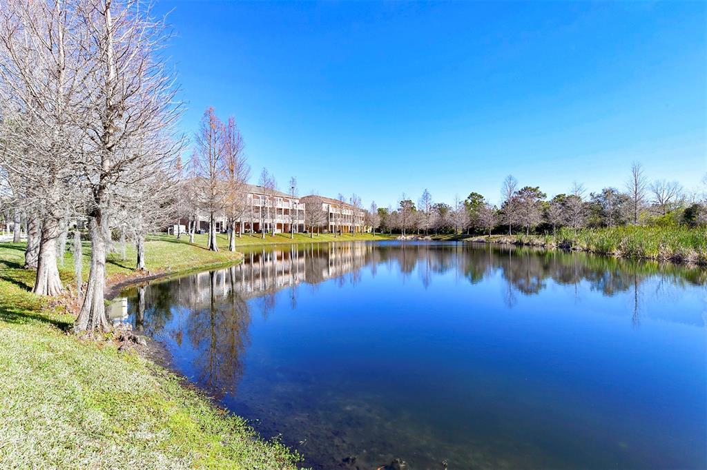 8922 White Sage Loop Lakewood Ranch, FL 34202 - Photo 62 of 65 a view of a lake with houses in the back
