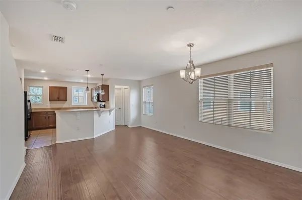 a view of a kitchen with a sink wooden floor and a kitchen