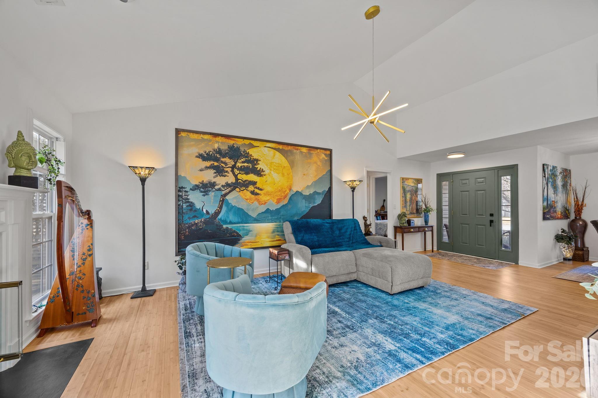244 Running Briar Road Fletcher, NC 28732 - Photo 12 of 45 a living room with furniture and a flat screen tv