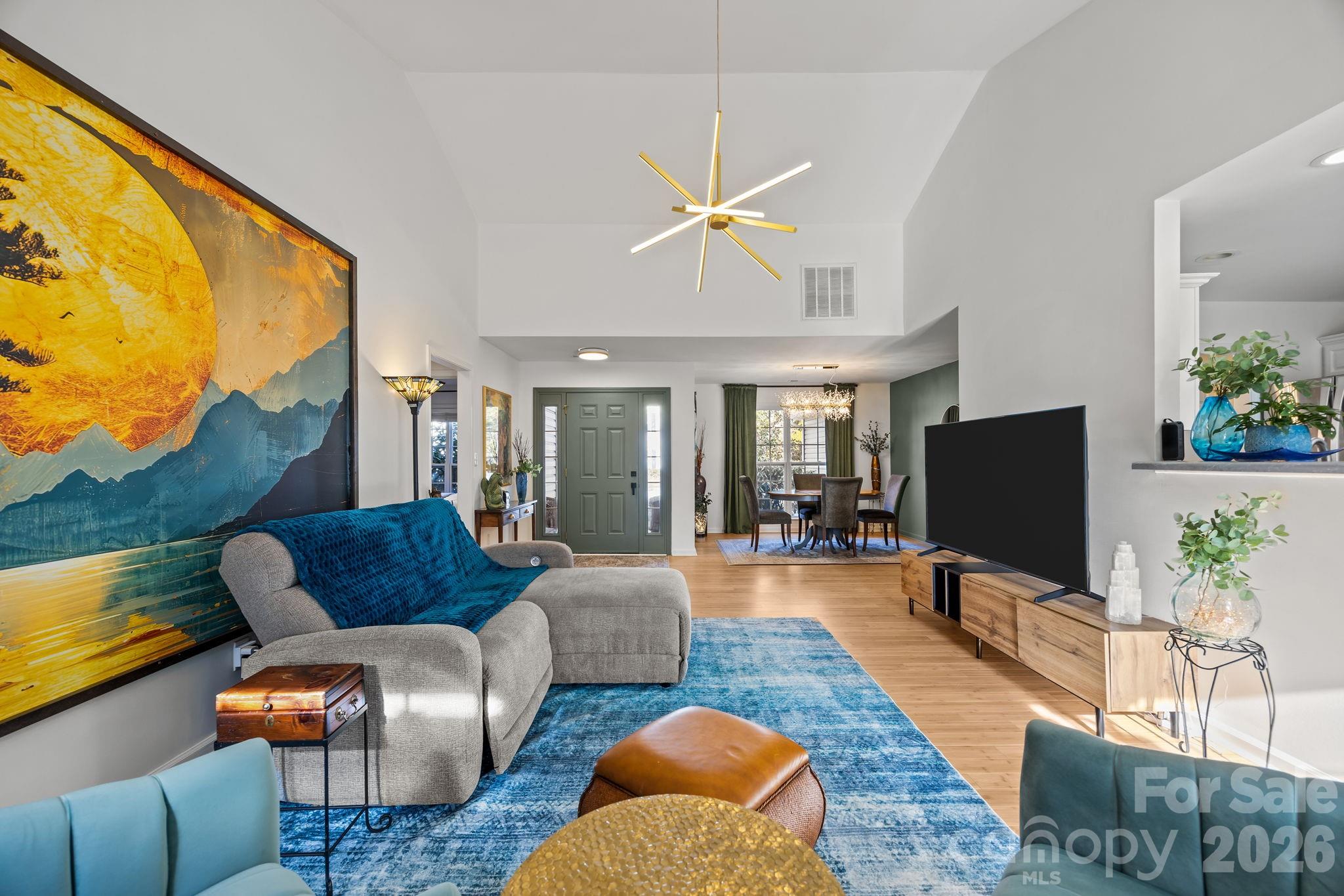 244 Running Briar Road Fletcher, NC 28732 - Photo 13 of 45 a living room with furniture and a flat screen tv