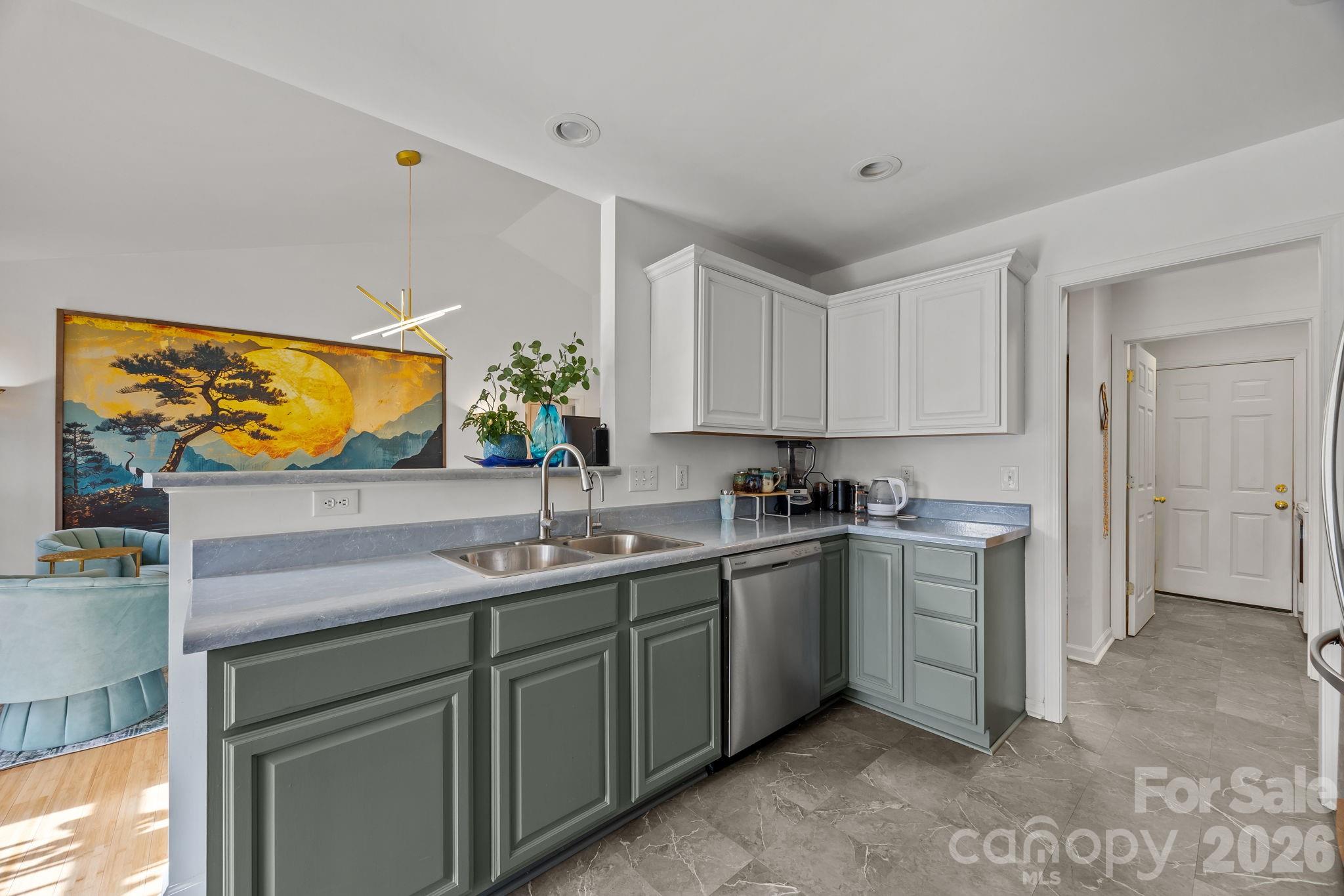 244 Running Briar Road Fletcher, NC 28732 - Photo 16 of 45 a kitchen with a sink and cabinets