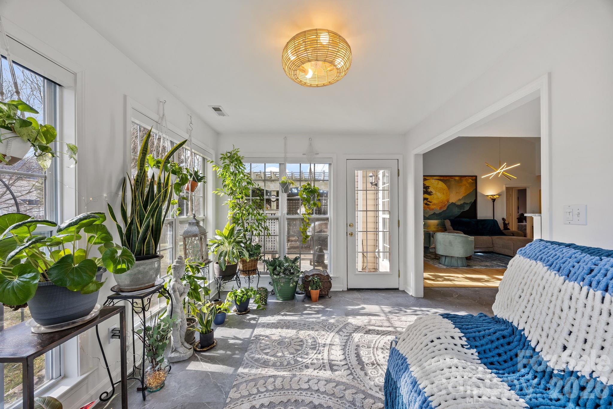 244 Running Briar Road Fletcher, NC 28732 - Photo 20 of 45 a living room filled with furniture and a potted plant
