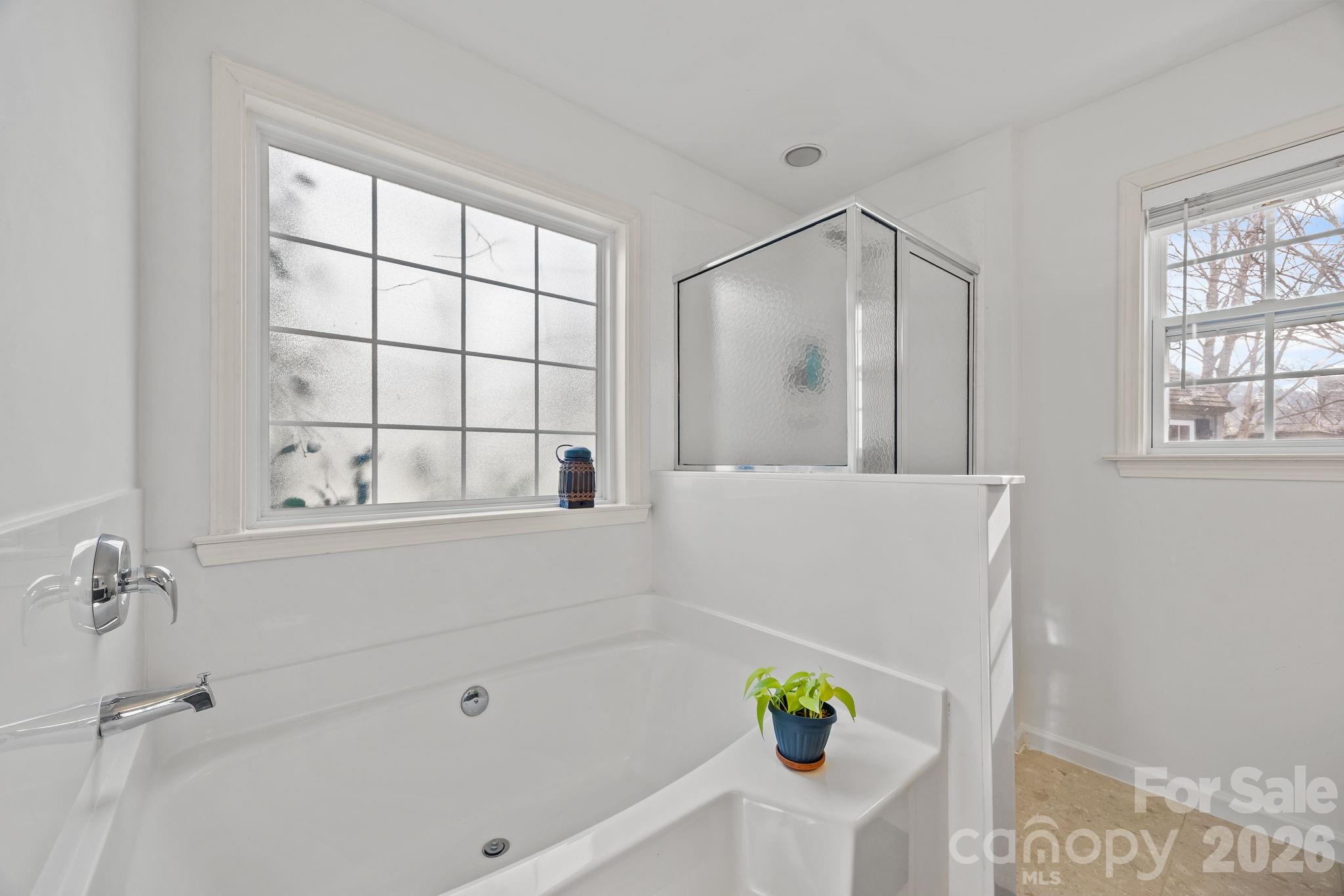 244 Running Briar Road Fletcher, NC 28732 - Photo 25 of 45 a bathroom with a bathtub and a shower