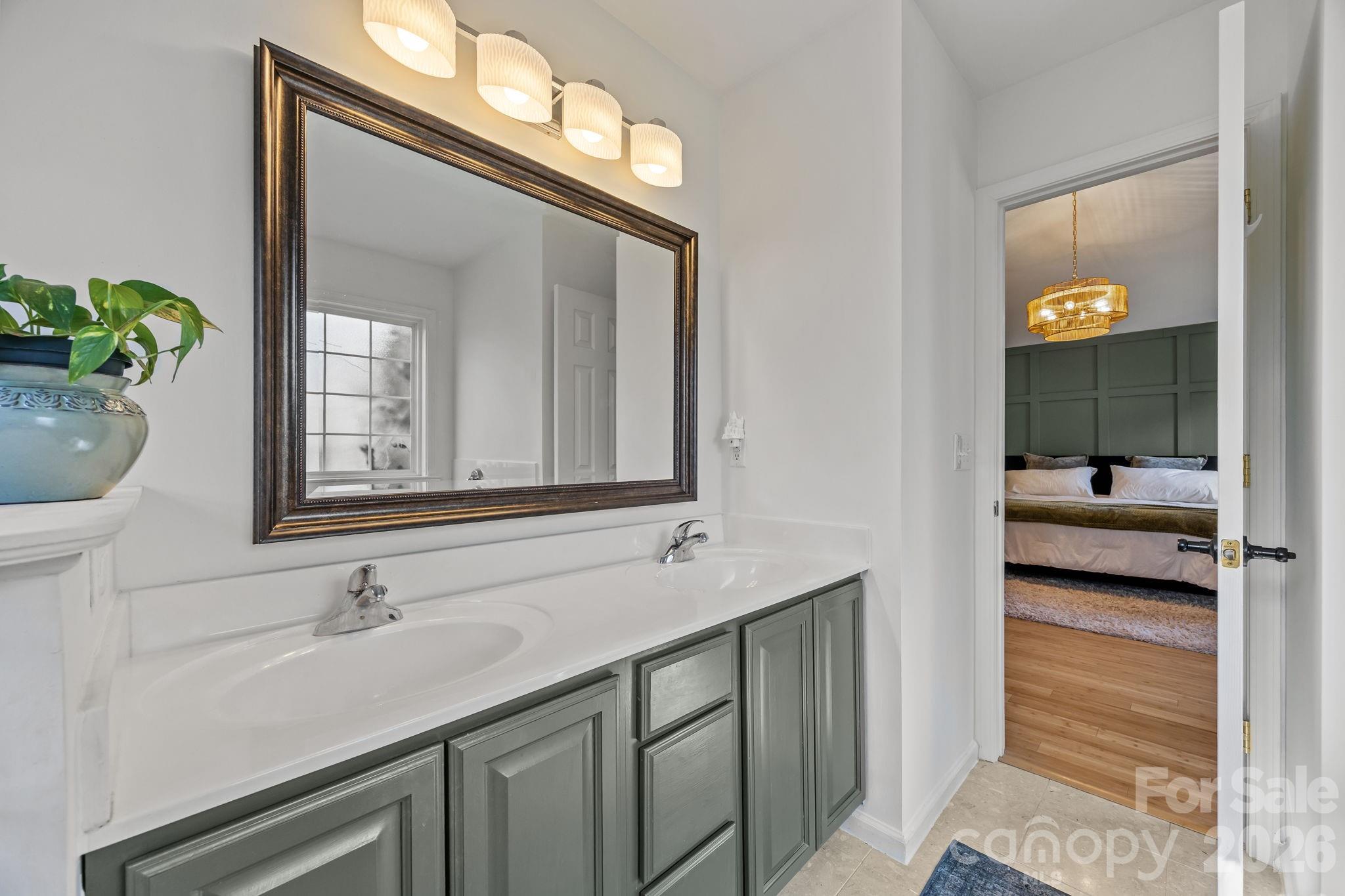 244 Running Briar Road Fletcher, NC 28732 - Photo 26 of 45 a bathroom with a sink and a mirror