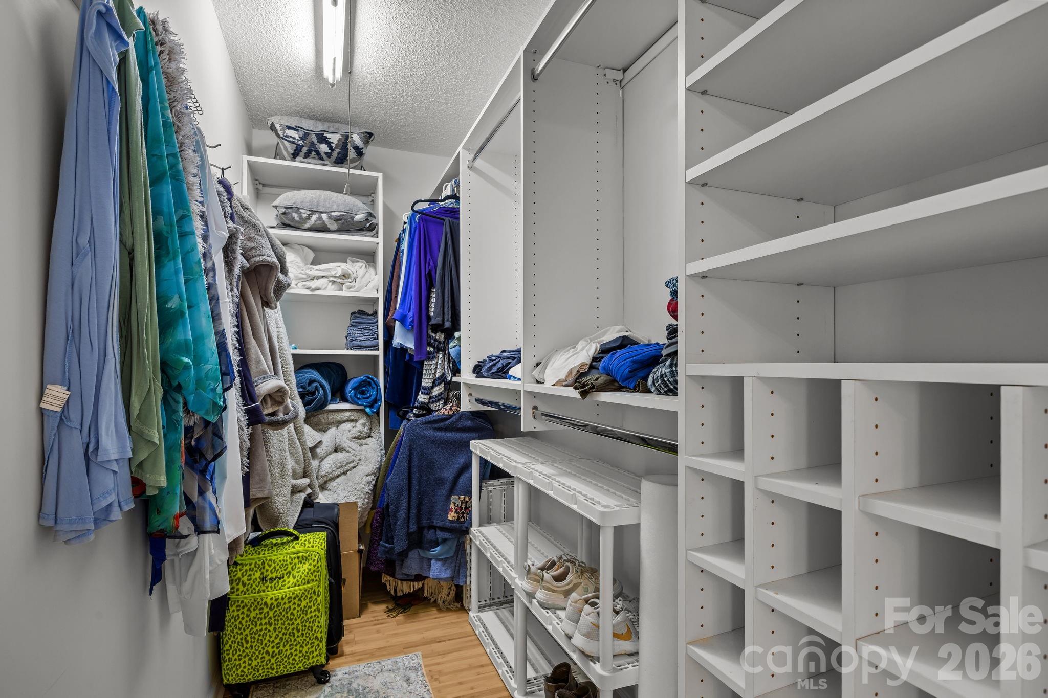 244 Running Briar Road Fletcher, NC 28732 - Photo 27 of 45 a view of walk in closet with clothes and shoes