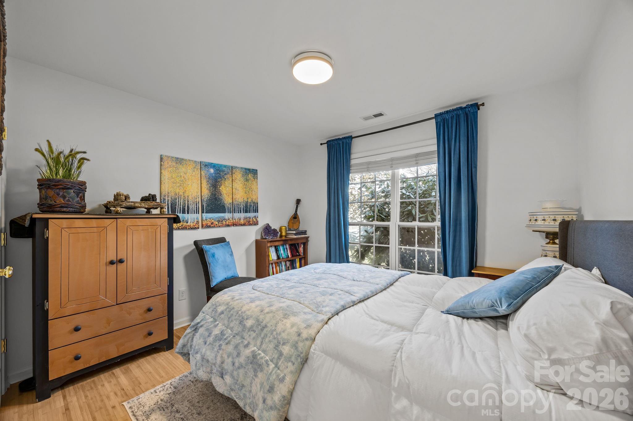 244 Running Briar Road Fletcher, NC 28732 - Photo 29 of 45 a bedroom with a bed and a window