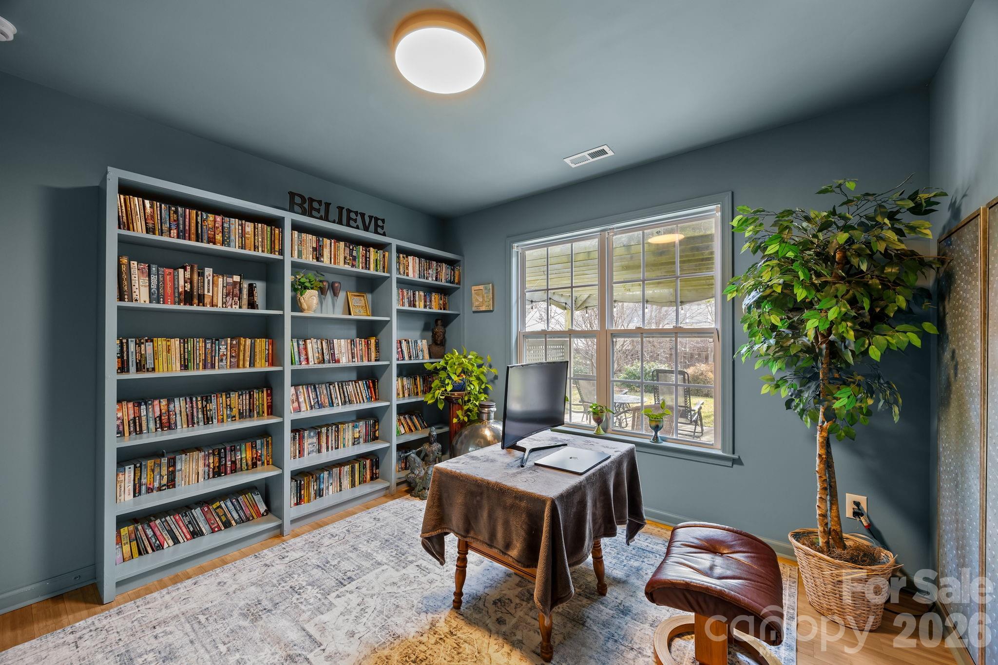 244 Running Briar Road Fletcher, NC 28732 - Photo 31 of 45 a workspace with furniture and a potted plant