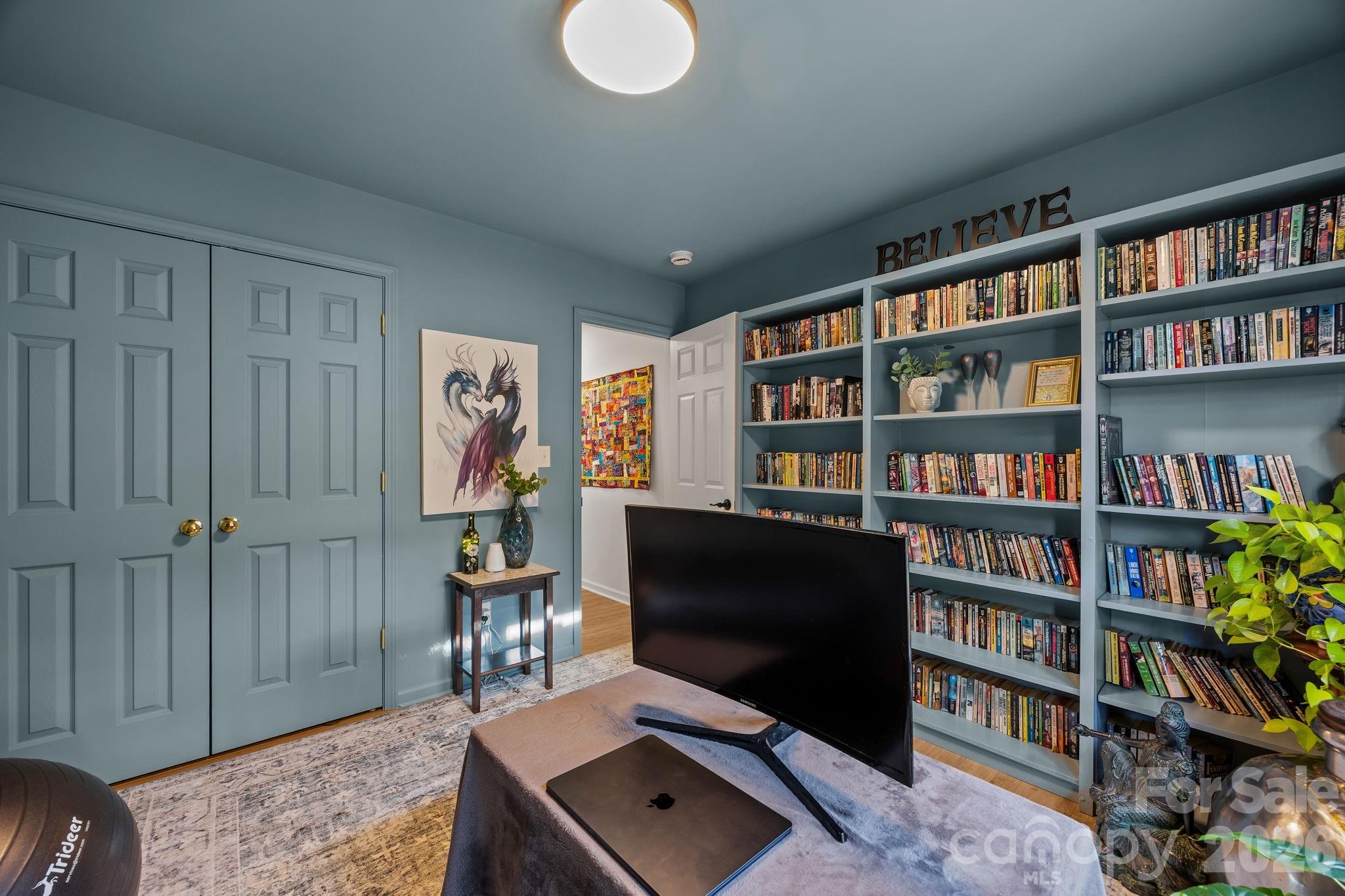 244 Running Briar Road Fletcher, NC 28732 - Photo 32 of 45 a view of a workspace with bookshelf