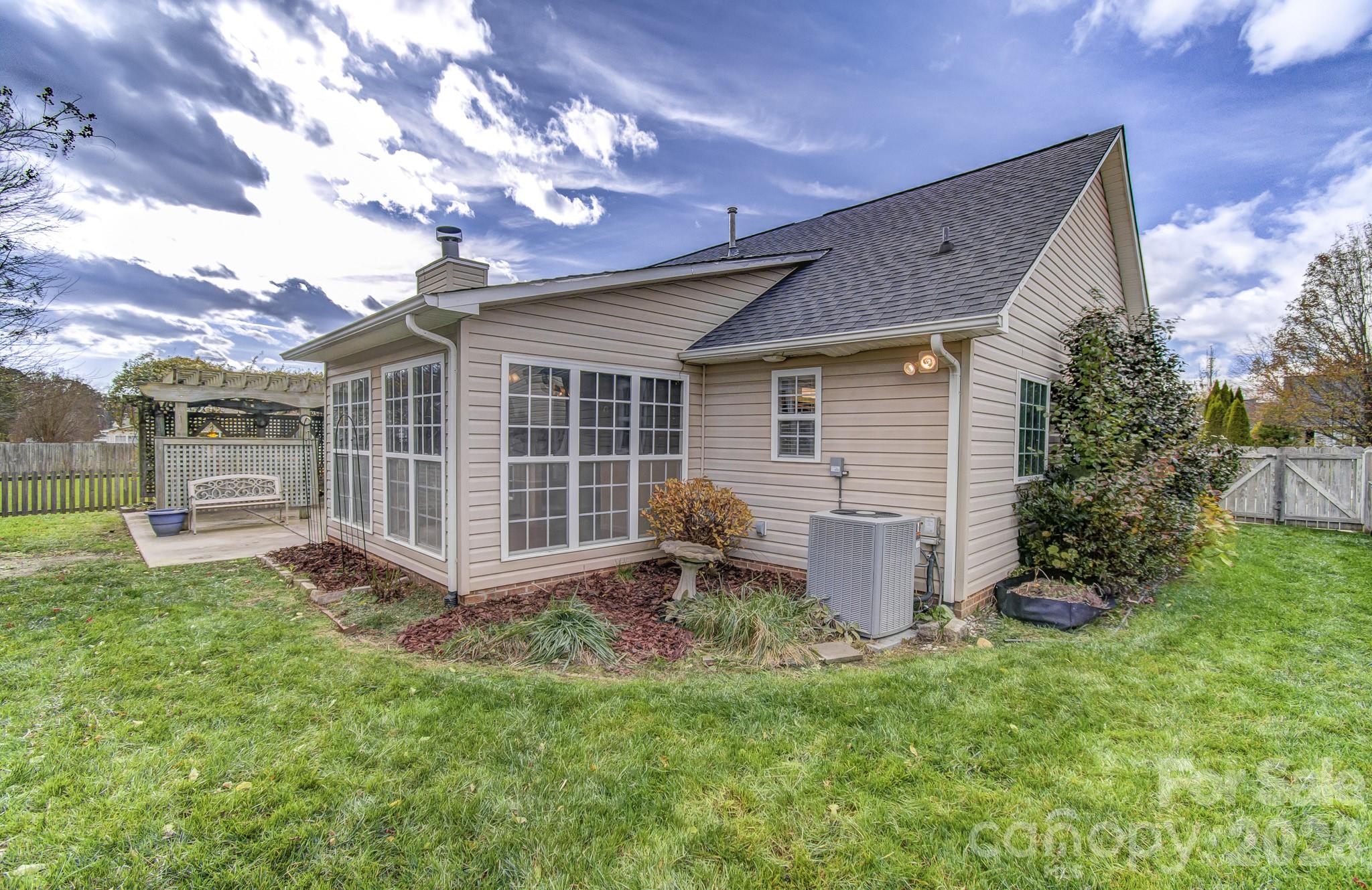 244 Running Briar Road Fletcher, NC 28732 - Photo 36 of 45 a backyard of a house with table and chairs