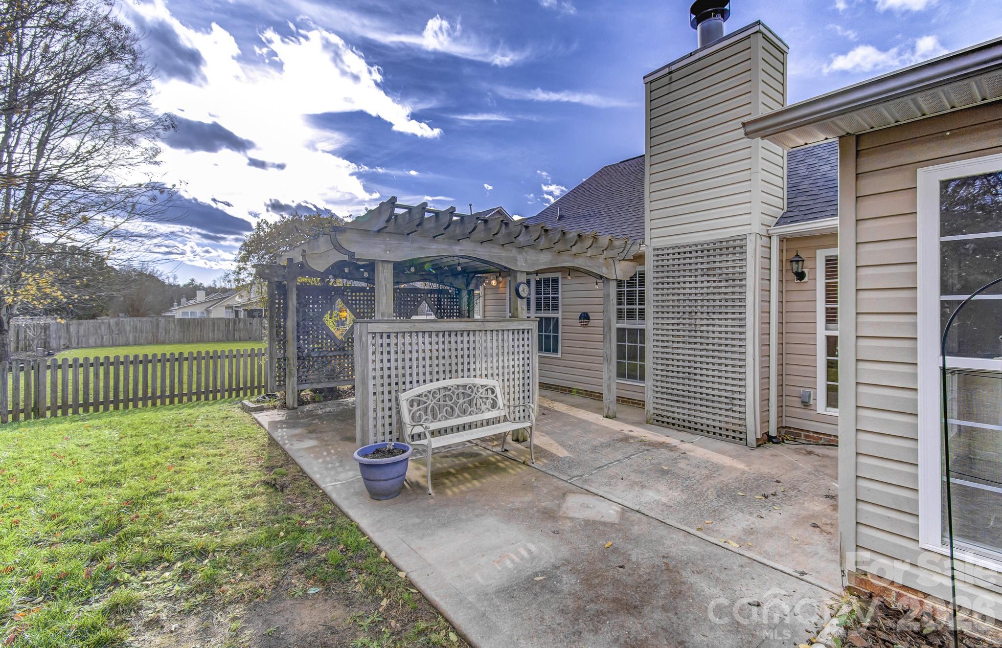 244 Running Briar Road Fletcher, NC 28732 - Photo 38 of 45 a view of a house with a yard and fence